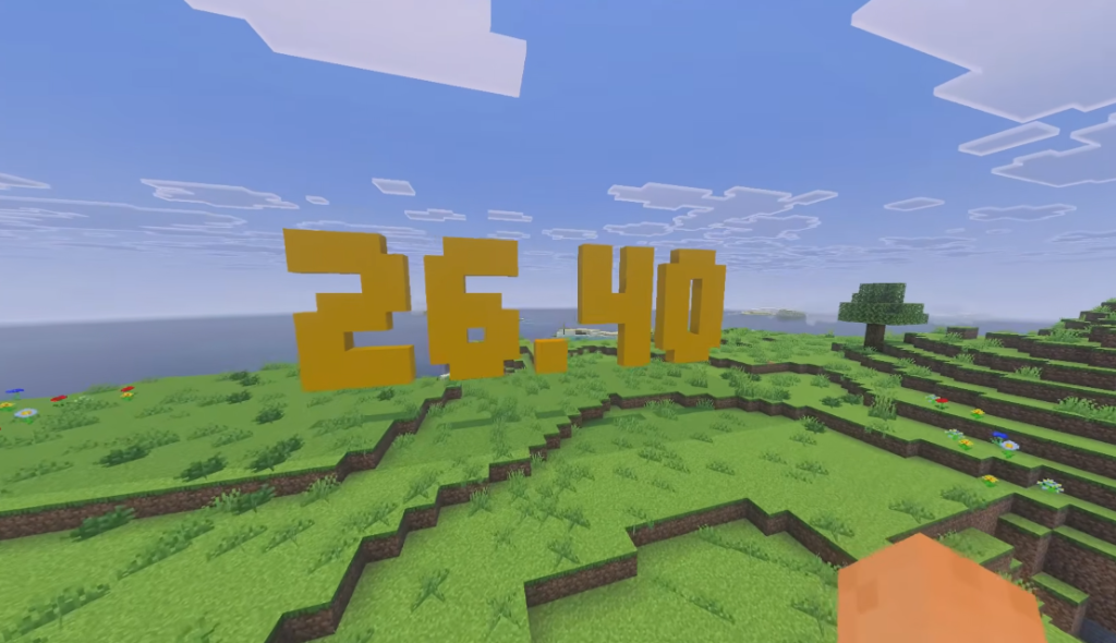 Giant golden Minecraft 26.40 text on a grassy field